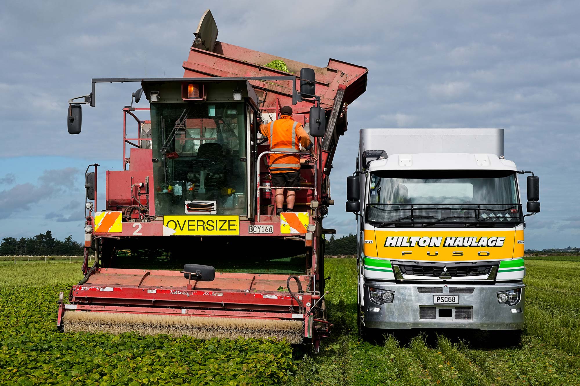 A FUSO Shogun working next to a harvester 